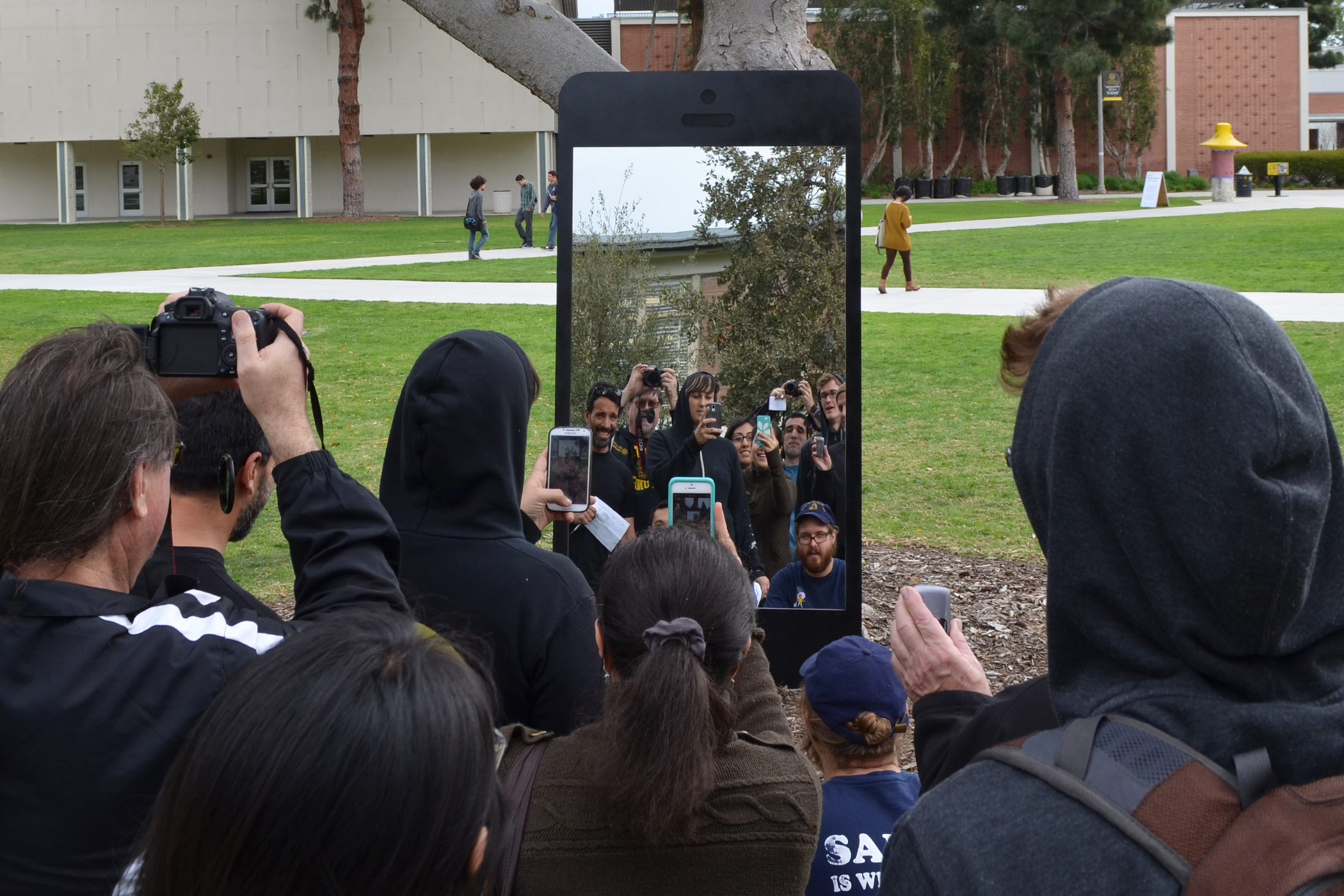 Gabe Ferreira: Screen Identity — Students engaging with the sculpture.