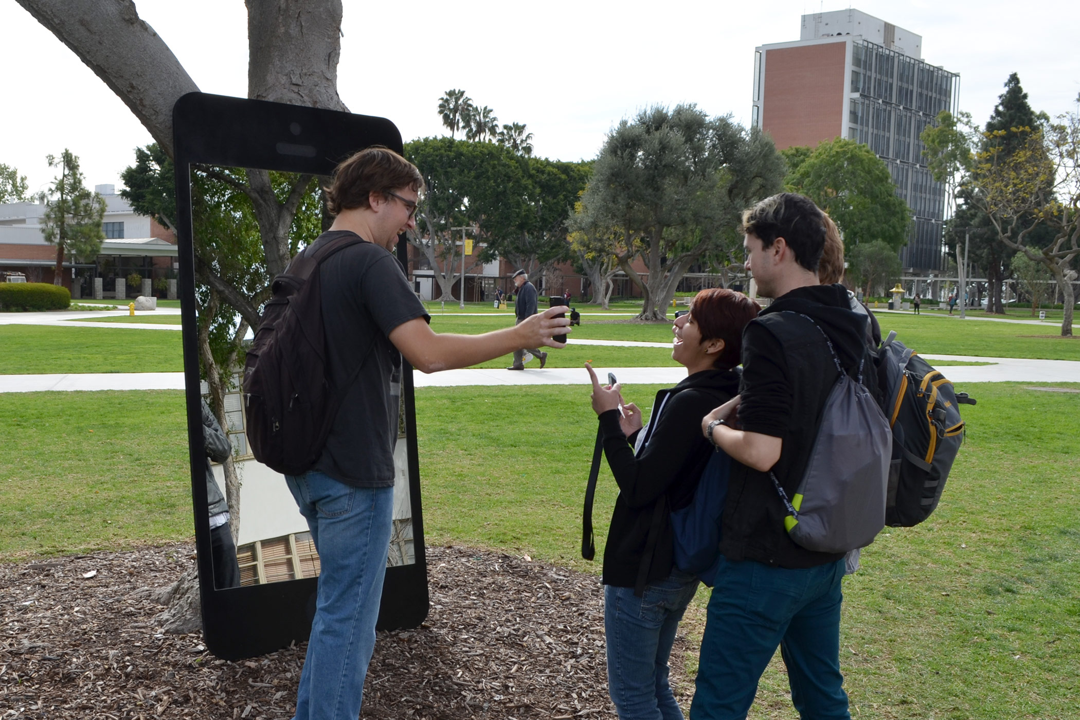 Gabe Ferreira: Screen Identity — Students looking at their selfie.