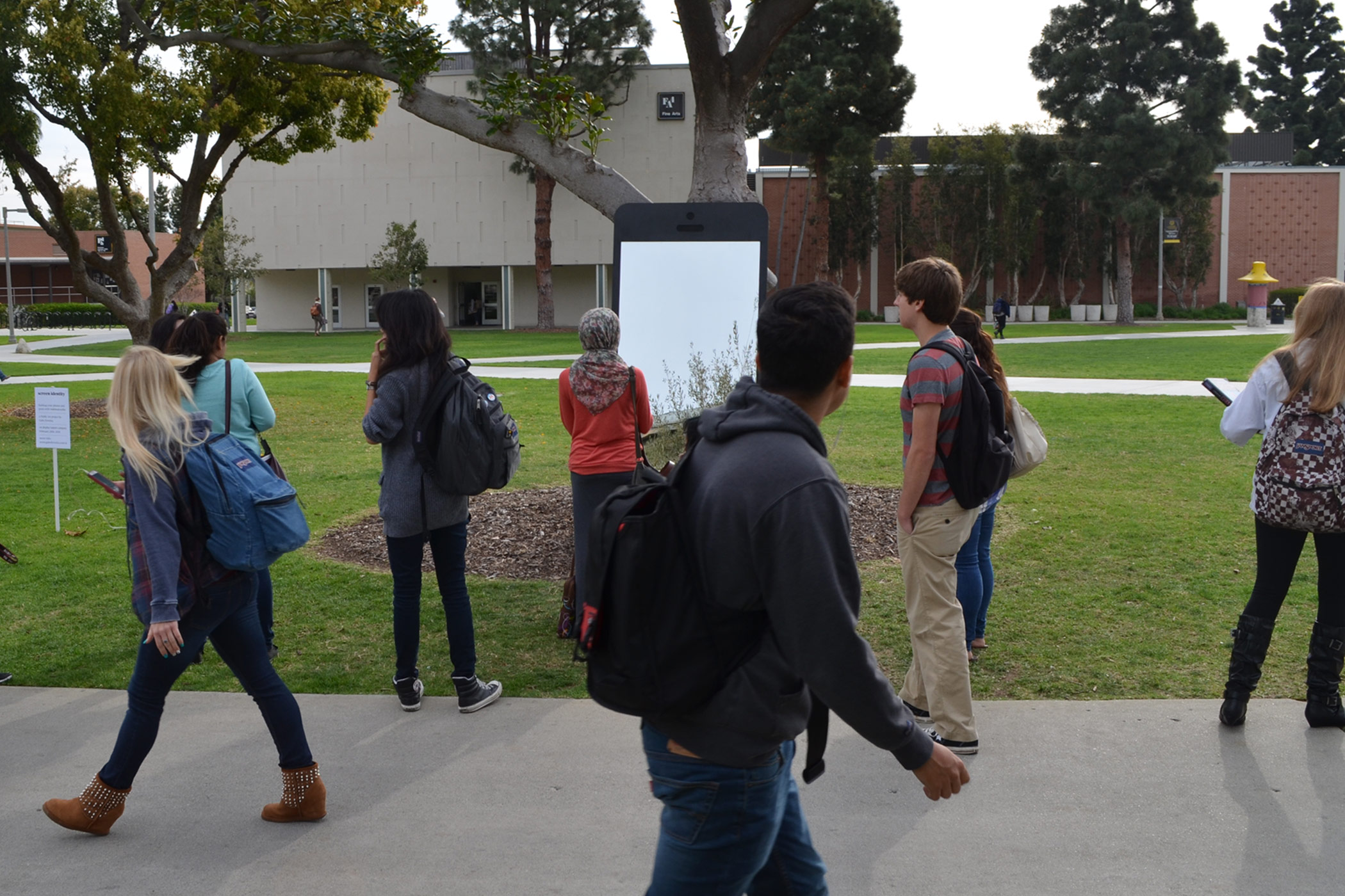 Gabe Ferreira: Screen Identity — Students engaging with the sculpture.